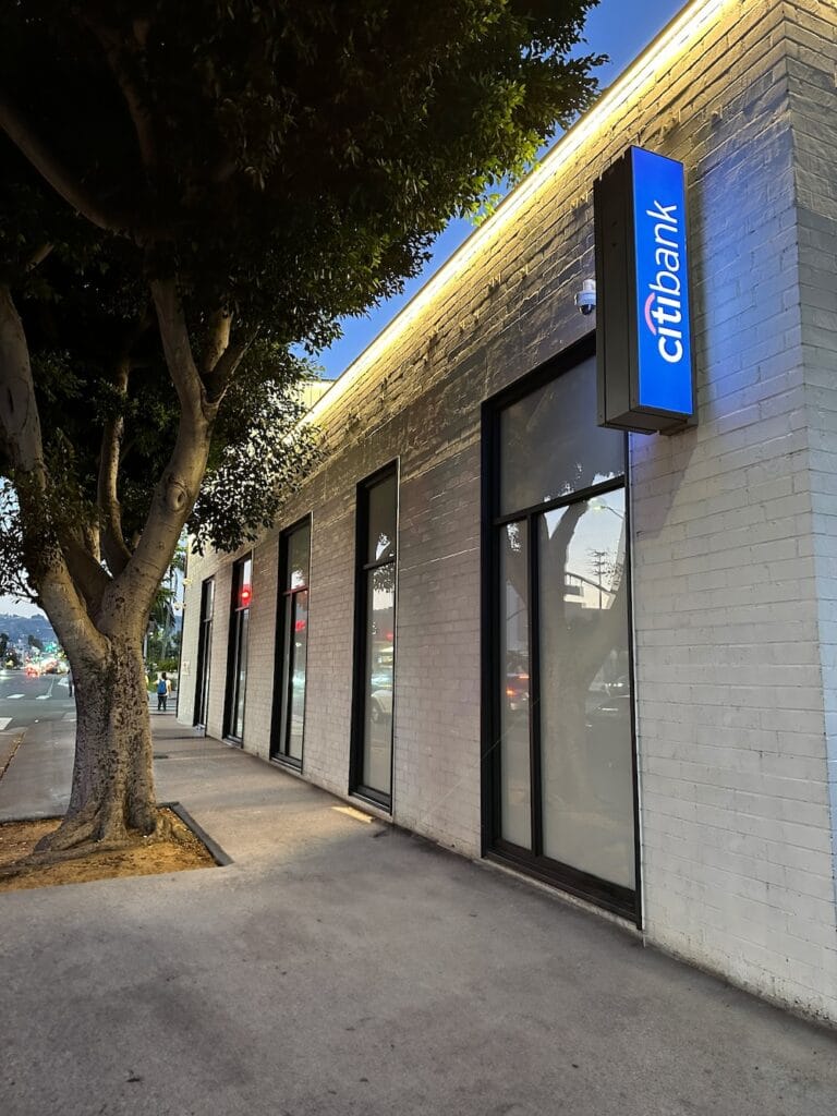 A perimeter LED light strip runs the length of a Citibank